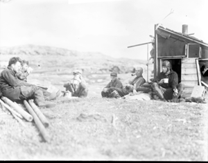 Image of Digging party at lunch by Norwegian hunters' hut